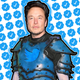 Image of Elon Musk surrounded by blue checkmarks